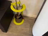 a black and yellow table with a cup of coffee on it