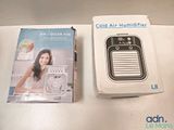 a box of air conditioner on the table next to a box of air conditioner