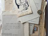 a box full of old letters and papers on a table