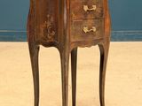 an old wooden table with a drawer on top of it