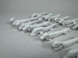 a lot of white ceramic animals that are on a table