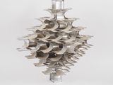 a large metal sculpture of a cluster of metal objects