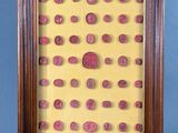 an image of a picture of a wooden frame with pink dots on it