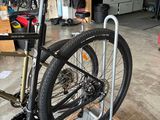 a bike that is sitting on a stand in a garage