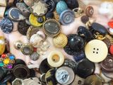 a pile of assorted buttons on a table