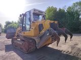 a yellow bulldozer that is parked in the dirt