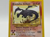 the card is yellow and has a black dragon on it