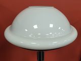 a white lamp that is on top of a table