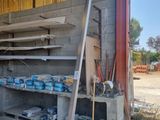 a garage with a lot of shelves and tools in it