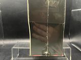clear acrylic display case with a hand holding a cigarette in it