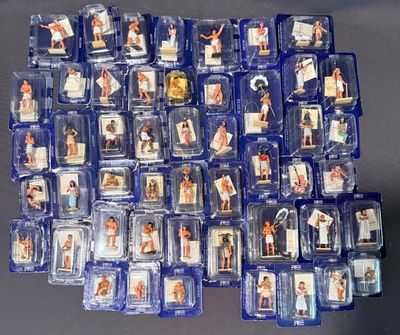 a lot of plastic figurines of people on a table