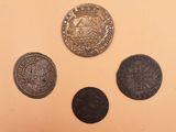 three different types of coins sitting on top of a table