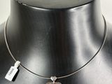 a close up of a necklace on a mannequin mannequin