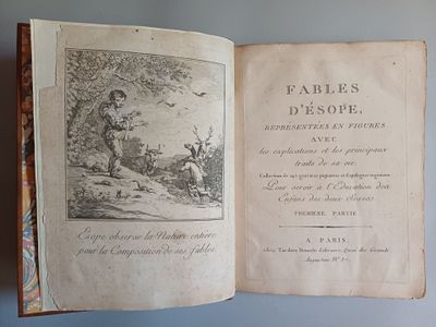 un vieux livre avec l'image d'un homme et d'un chien