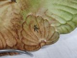 a plate with a bird on it on a table