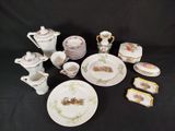 many plates, cups, cups, and saucers on the table