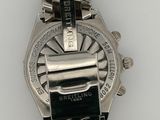 an image of a close up of a wrist watch on a white surface