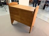 a wooden table with a drawer on it in the middle of a room