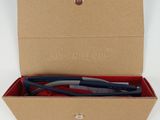 a box with a pen in it and a pen in it