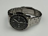 a watch that is sitting on a white surface