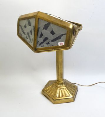 an image of a gold desk lamp with a glass shade on it