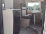 a small kitchen in the back of a camper van