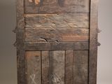 an old wooden cabinet with a drawer on top of it