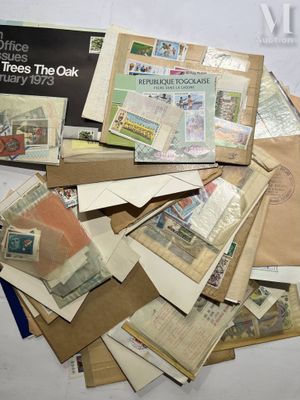 a pile of mail sitting on top of a table