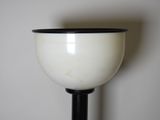 a black and white lamp that is on a table