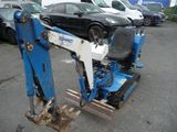 an image of a blue and white machine parked in a parking lot