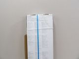a box with a blue tape on it sitting on a table