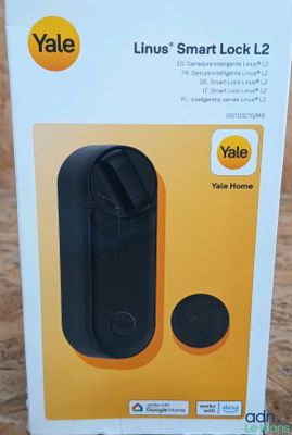the box is open on a table with a phone in it