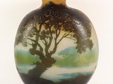 a vase with a painting of a tree on it