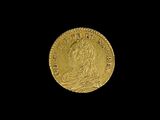 l'image d'une pièce d'or sur laquelle figure une femme