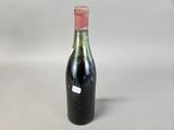 a bottle of wine that is sitting on a table