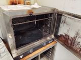a dirty toaster oven with the door open