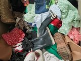 a box full of clothes and shoes inside of it