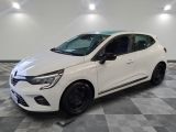 a white car parked in a garage with a checkered floor