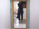 a person taking a picture of themselves in a mirror