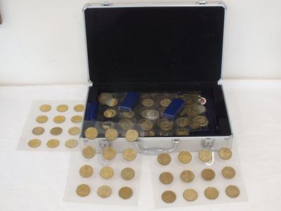 a suitcase full of coins sitting on a table