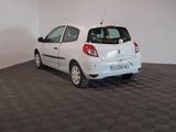 a picture of a white car parked in a room