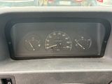 a car dashboard with a speedometer and gauges in it