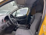 a small yellow van with a steering wheel and dashboard