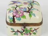 a small white box with a floral design on it