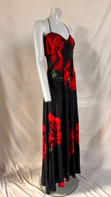a woman ' s black and red dress with roses on it