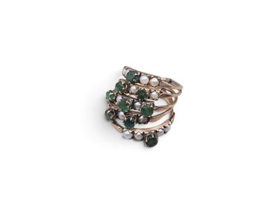 a close up of a ring on a white surface