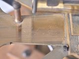 a close up of a machine that has a metal plate on it