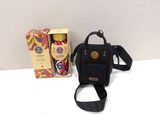 a small black bag with a black strap next to a box of coffee