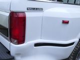 a white truck that is parked in the parking lot