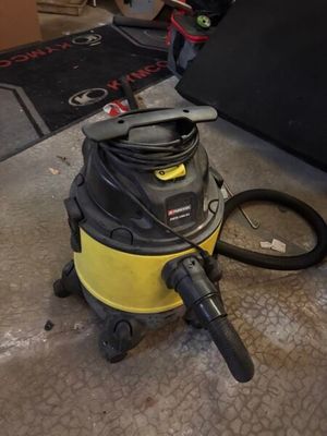 a vacuum cleaner sitting on the floor in a room